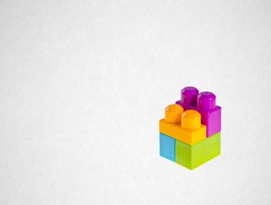 Plastik yapı taşları veya bir arka plan üzerinde Lego blokları
