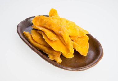 Bir arka plan üzerinde kurutulmuş Mango veya kurutulmuş Mango dilimleri.
