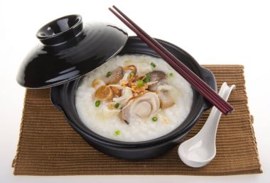 Porridge, abalone & chicken Porridge (congee) served in claypot clipart
