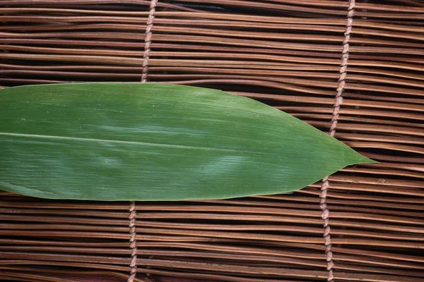 Cozinha japonesa. vazio de bambu mat fundo — Fotografia de Stock