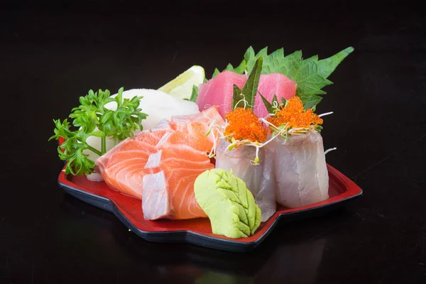 Japanse keuken. Sashimi op de achtergrond — Stockfoto