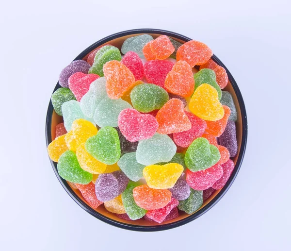 Caramelos. Los bombones de gelatina en el plato sobre el fondo. caramelos de gelatina en —  Fotos de Stock