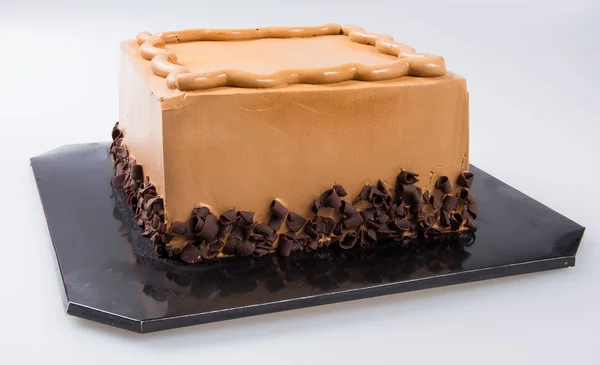 Torta o torta al cioccolato su uno sfondo . — Foto Stock