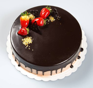 pasta ya da kek çilek ve çikolata bir arka plan üzerinde.