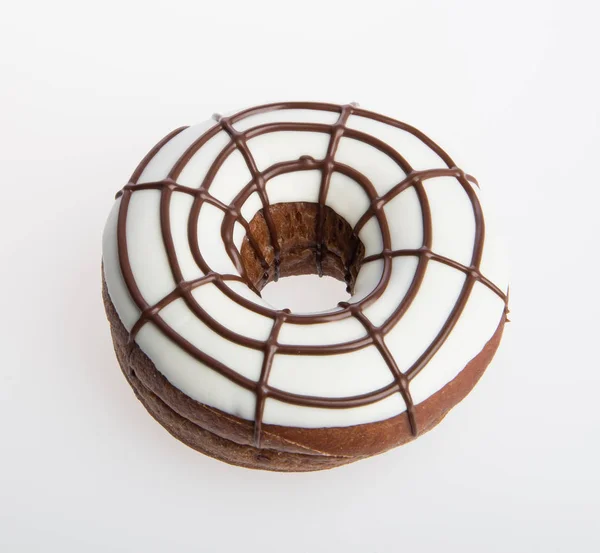 Dona o donut de chocolate sobre un fondo . — Foto de Stock