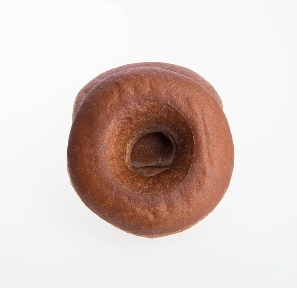 Donut ou donut fresco em um fundo . — Fotografia de Stock