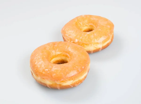 Donut lub klasyczny pączek na tle. — Zdjęcie stockowe