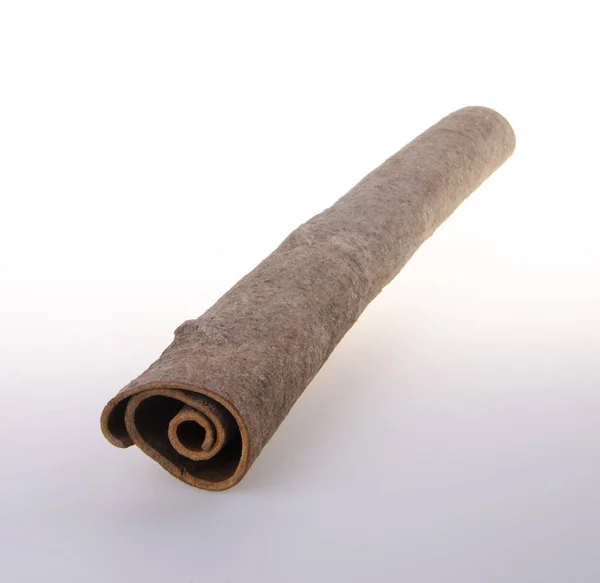 Cinnamon or cinnamon stick on a background. — Stock Photo, Image