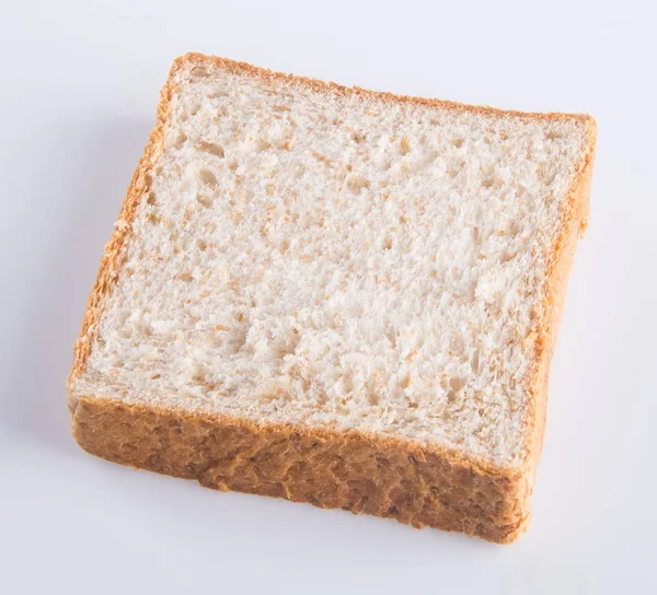 Rebanada de pan sobre un fondo —  Fotos de Stock