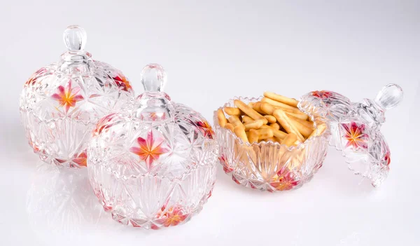 Crystal bowl with food on a background. — Stock Photo, Image