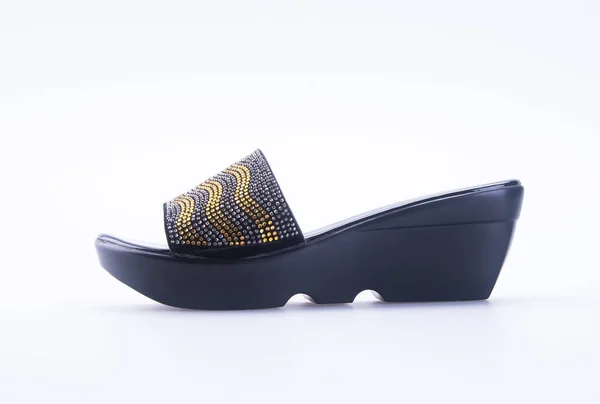 Schoen of vrouw sandaal op een achtergrond. — Stockfoto