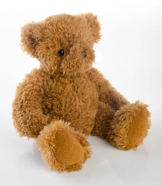 Urso de brinquedo ou brinquedo em um fundo . — Fotografia de Stock
