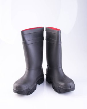 bir arka plan üzerinde ayakkabı veya siyah renk lastik çizmeler.