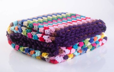 battaniye veya tığ işi battaniye bir arka plan üzerinde.