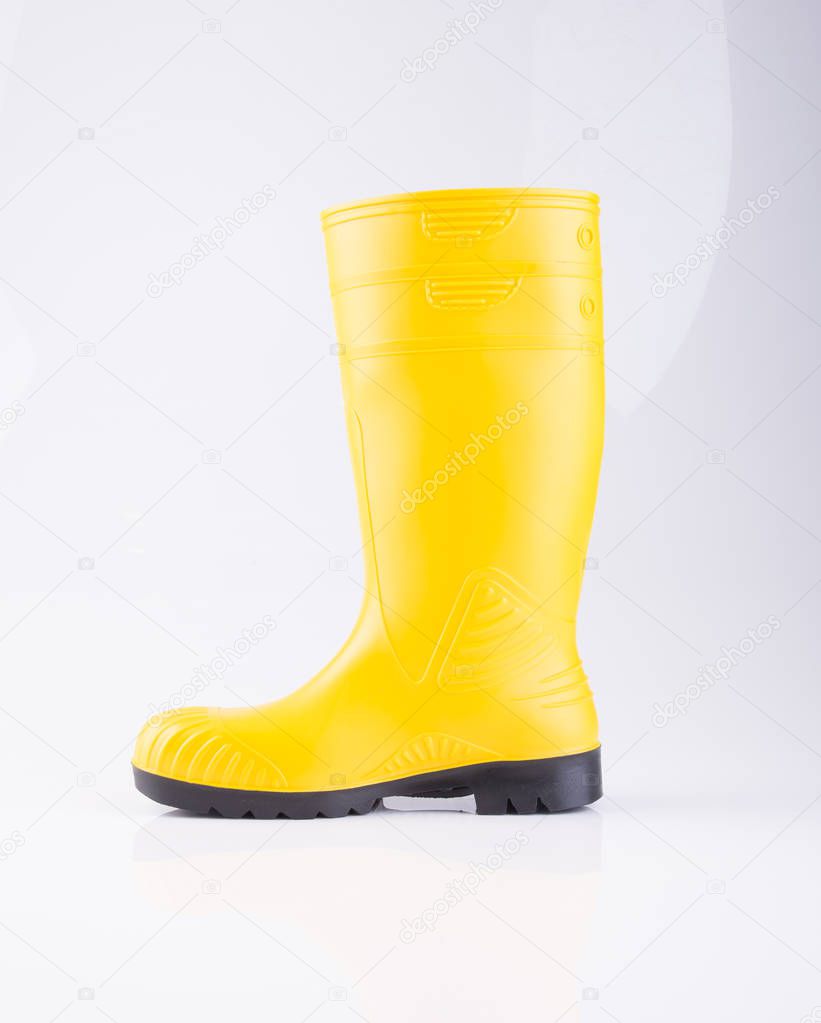 shoe or yellow color rubber boots on a background.
