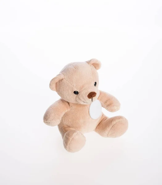 Urso de brinquedo ou brinquedo em um fundo . — Fotografia de Stock