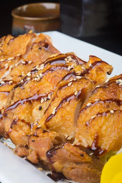 Japanese cuisine. fried chicken on the background — Stock Photo, Image