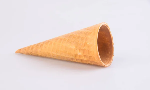 Corneto de sorvete em um contexto. Vazio corneto de sorvete em um ba — Fotografia de Stock
