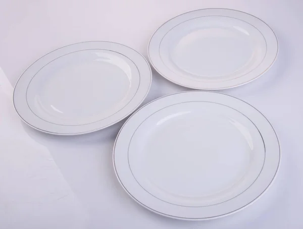 Plate or ceramic plate on a background. — Stock Photo, Image