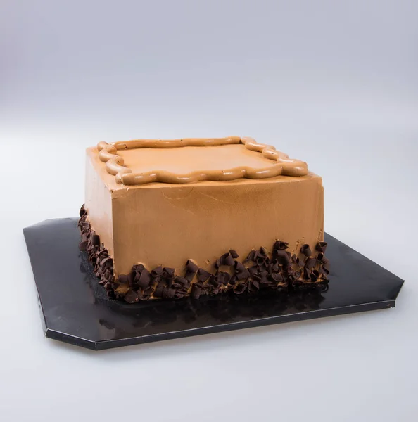 Torta, vagy csokoládé torta a háttér. — Stock Fotó