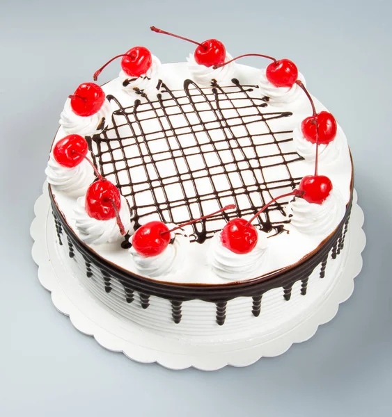 Gebak of chocolade cake op een achtergrond. — Stockfoto