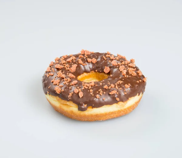 Donut lub czekolada pączek na tle. — Zdjęcie stockowe