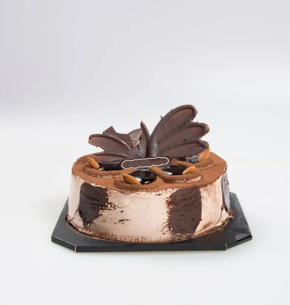 Torta o torta al cioccolato su uno sfondo . — Foto Stock