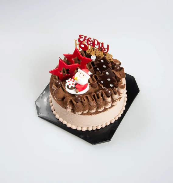 Cake of Kerst gebak met santa op een achtergrond. — Stockfoto