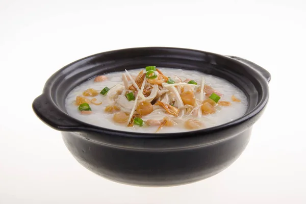 Traditional chinese scallop porridge rice gruel served in claypo — Stock Photo, Image