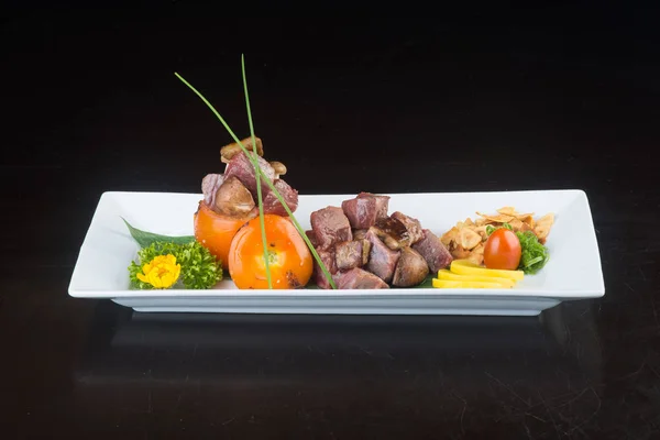 Japanese cuisine. beef cube on the background — Stock Photo, Image