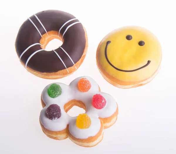 Verschiedene Donuts Donuts auf einem Hintergrund — Stockfoto