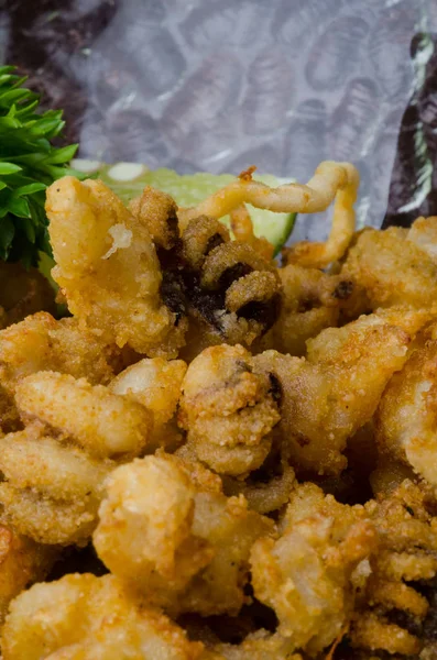 japanese cuisine. fried squid on the background