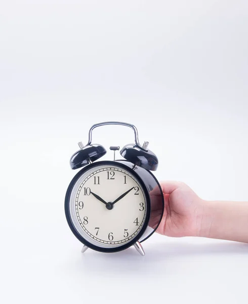 Clock or alarm clock with hand on a background new. — Stock Photo, Image