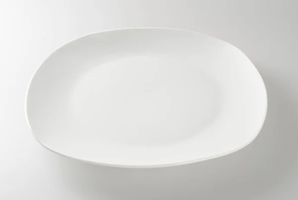 Plate or empty plate on a background new. — 스톡 사진