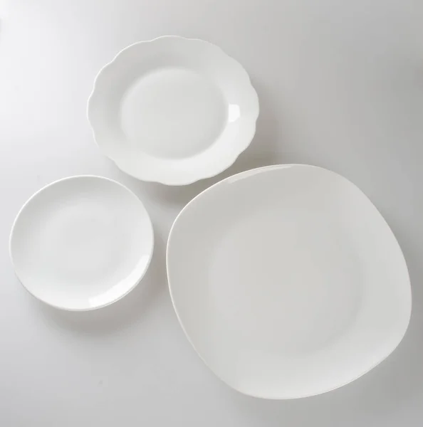 Plate or empty plate on a background new. — Stock Photo, Image