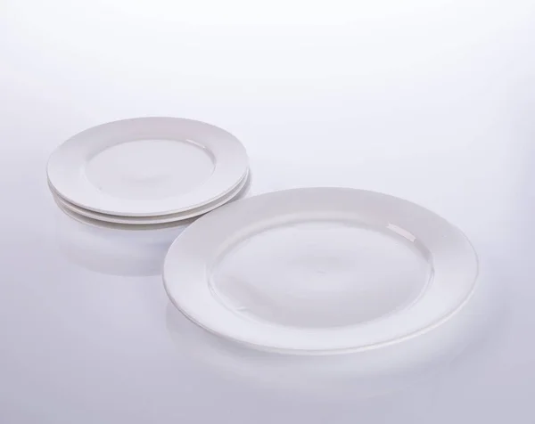 Plate or empty plate on a background new. Royalty Free Stock Photos