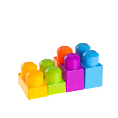 Yeni arkaplanda oyuncak ya da plastik yapı taşları.