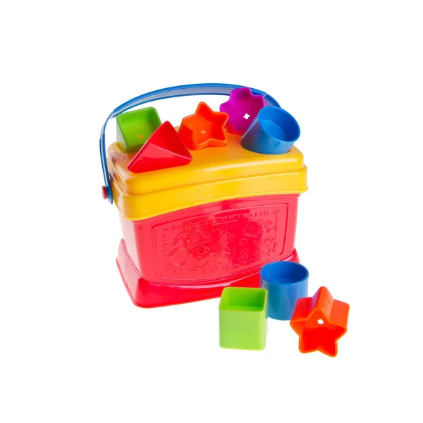 おもちゃや赤ちゃんのおもちゃプラスチック形状ソーター上の背景新しい — ストック写真