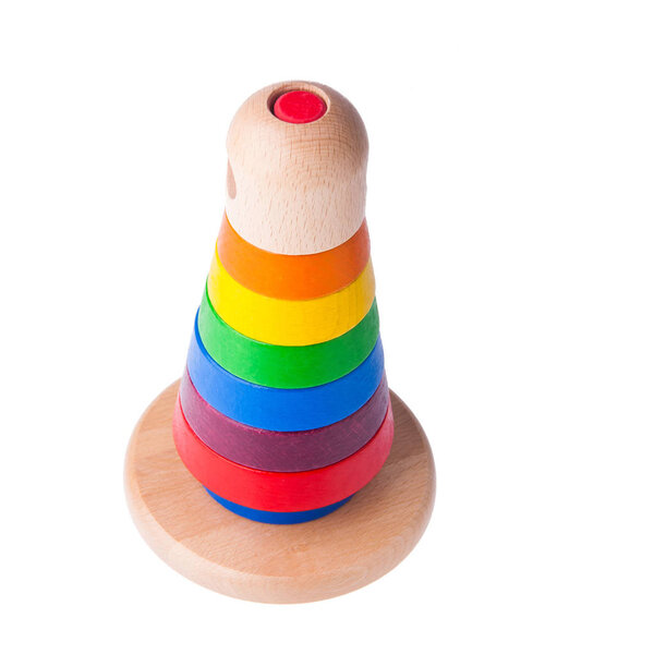 Toy or baby toy wood color pyramid on background new