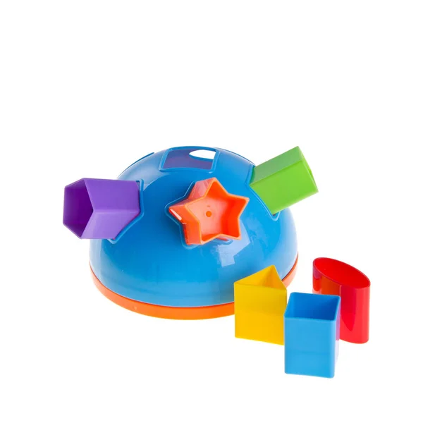 おもちゃや赤ちゃんのおもちゃプラスチック形状ソーター上の背景新しい — ストック写真