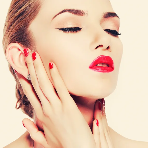 Portrait of young woman with red lips — Stock Photo, Image
