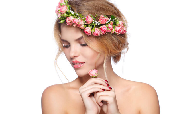 Blonde girl with roses chaplet in hair