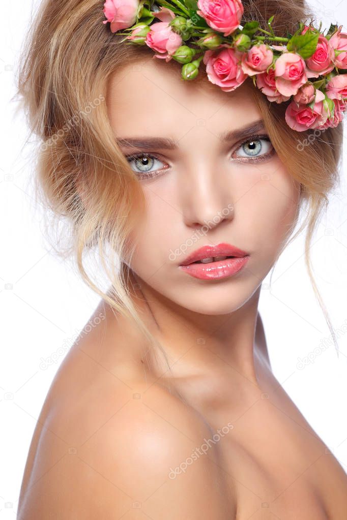 Blonde girl with roses chaplet in hair