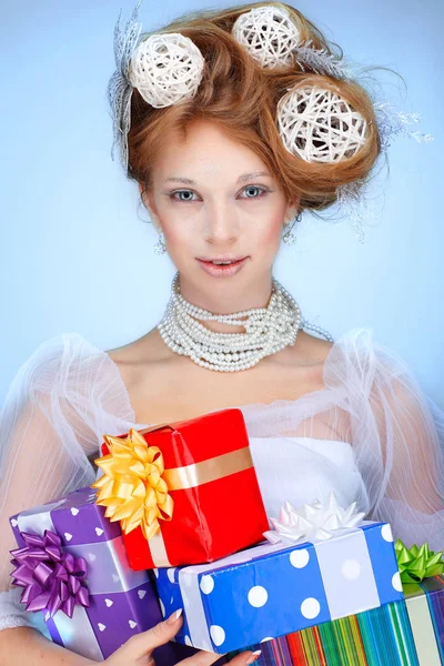 Redheaded girl with new-year decorations in hair — Stock Photo, Image