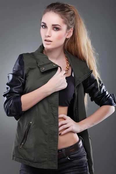 A photo of beautiful girl is in fashion style on grey  background, glamour — Stock Photo, Image