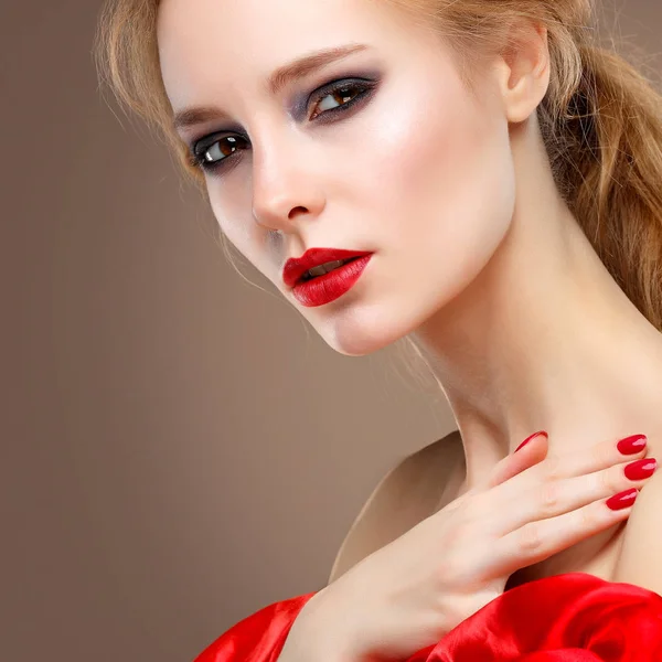 Closeup portrait of sexy young woman with beautiful red lips in red clothes — Stock Photo, Image