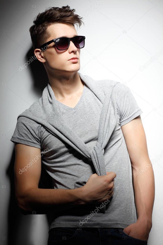Sexy young man in fashion style. Male model. 