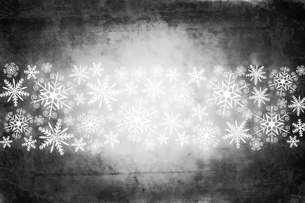 Grunge Vánoční pozadí v tmavě šedé s bílými sněhové vločky — Stock fotografie
