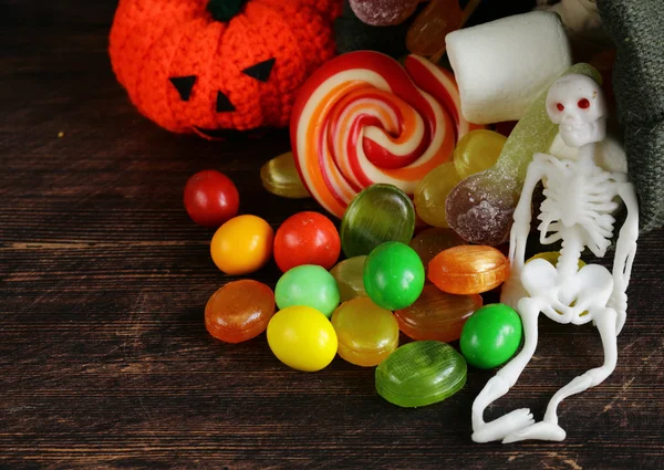 Candy and sweet muffins, decorations for Halloween — Stock Photo, Image