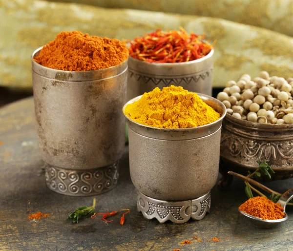 Assorted spices (saffron, pepper, turmeric, cinnamon) — Stock Photo, Image